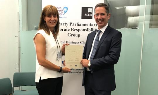 Jonathan Djanogly presents a Corporate Responsibility certificate to Helen Dighton of Encocam