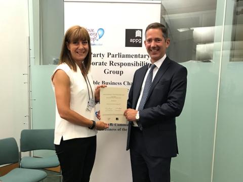 Jonathan Djanogly presents a Corporate Responsibility certificate to Helen Dighton of Encocam